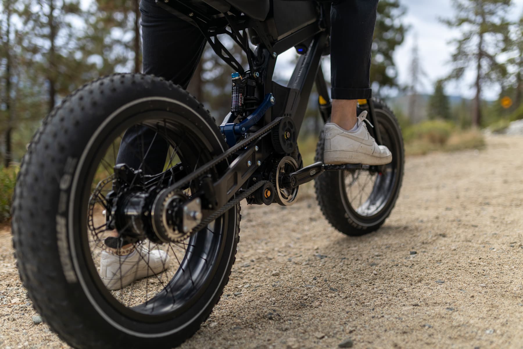 Rider on a Surfline cruising a scenic Tahoe road in daylight